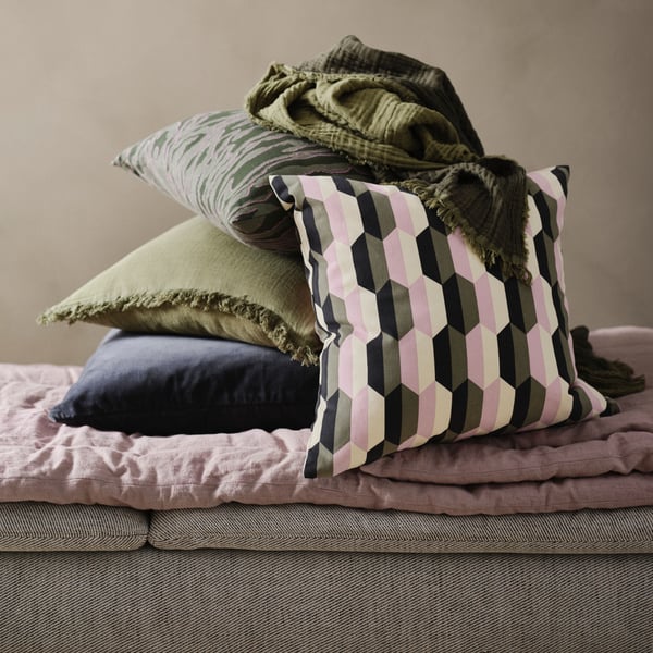 A dark grey SANELA cushion cover