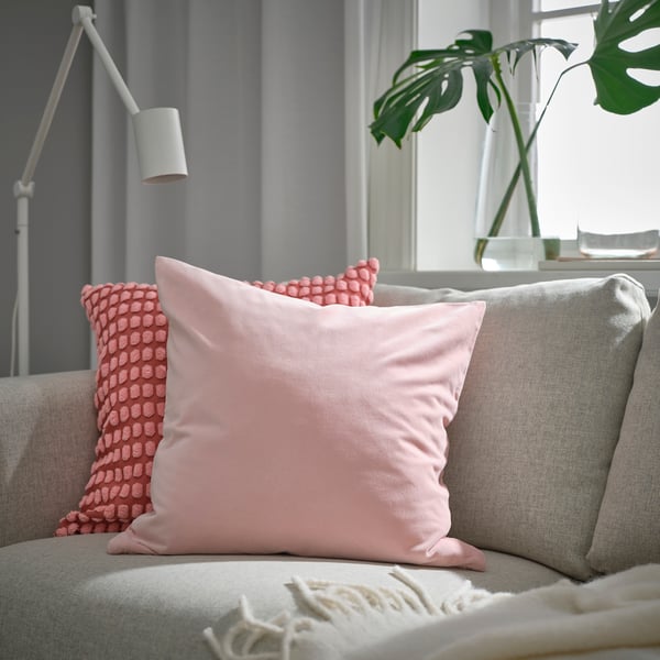 A pale pink SANELA cushion cover