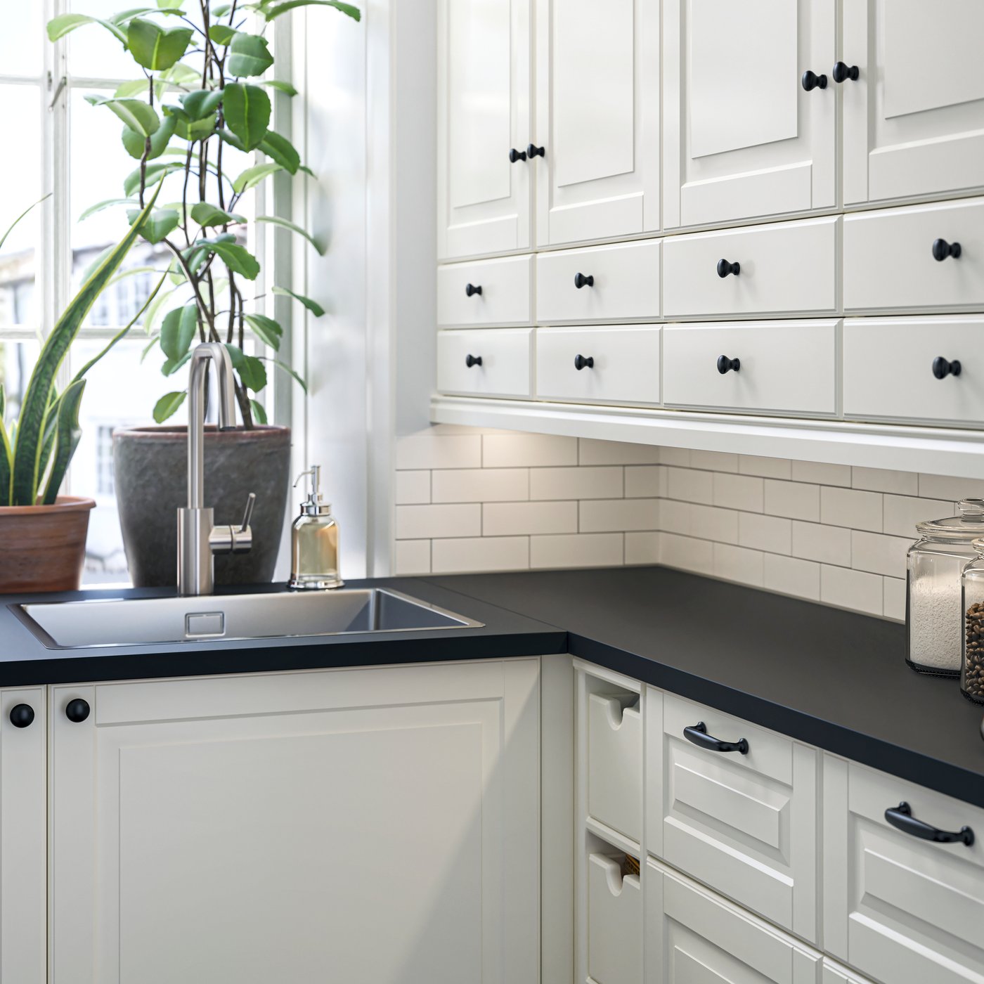 A clear glass VARDAGEN jar with lid