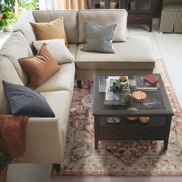 A dark grey SANELA cushion cover