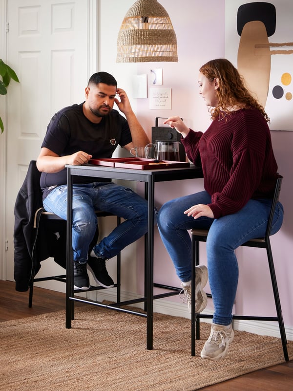 A black/black SANDSBERG bar table and 2 bar stools