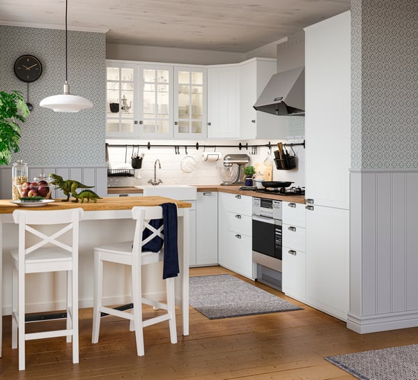 A white INGOLF bar stool with backrest in the kitchen