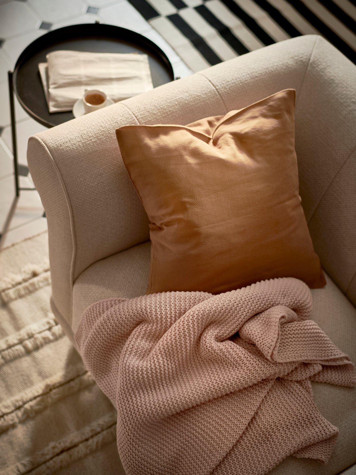 A pale pink INGABRITTA throw