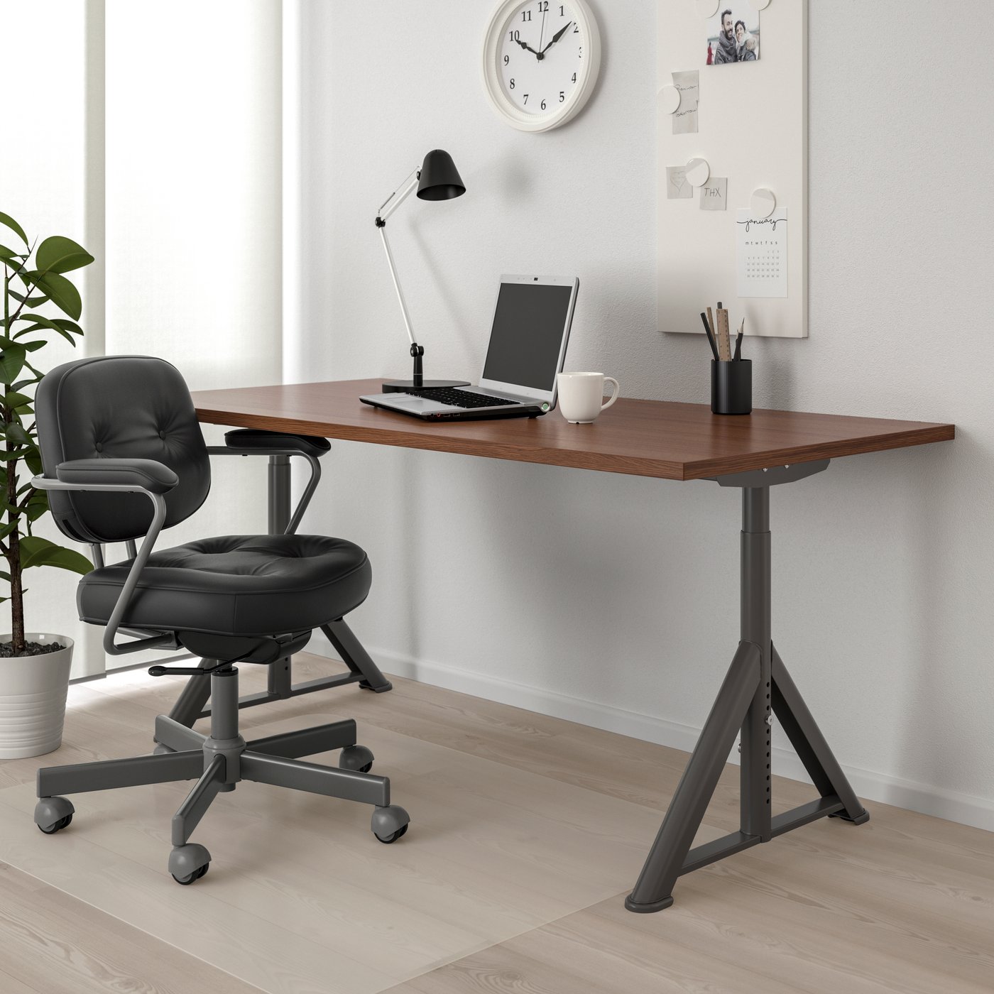 A brown/dark grey IDÅSEN desk