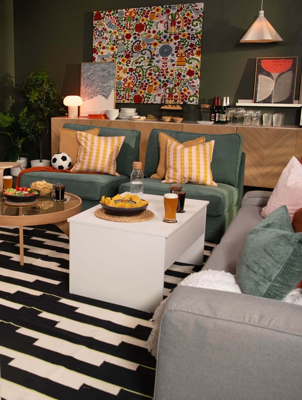 A white ÖSTAVALL adjustable coffee table