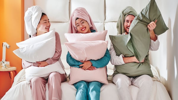 A grey-green DVALA pillowcase in the bedroom