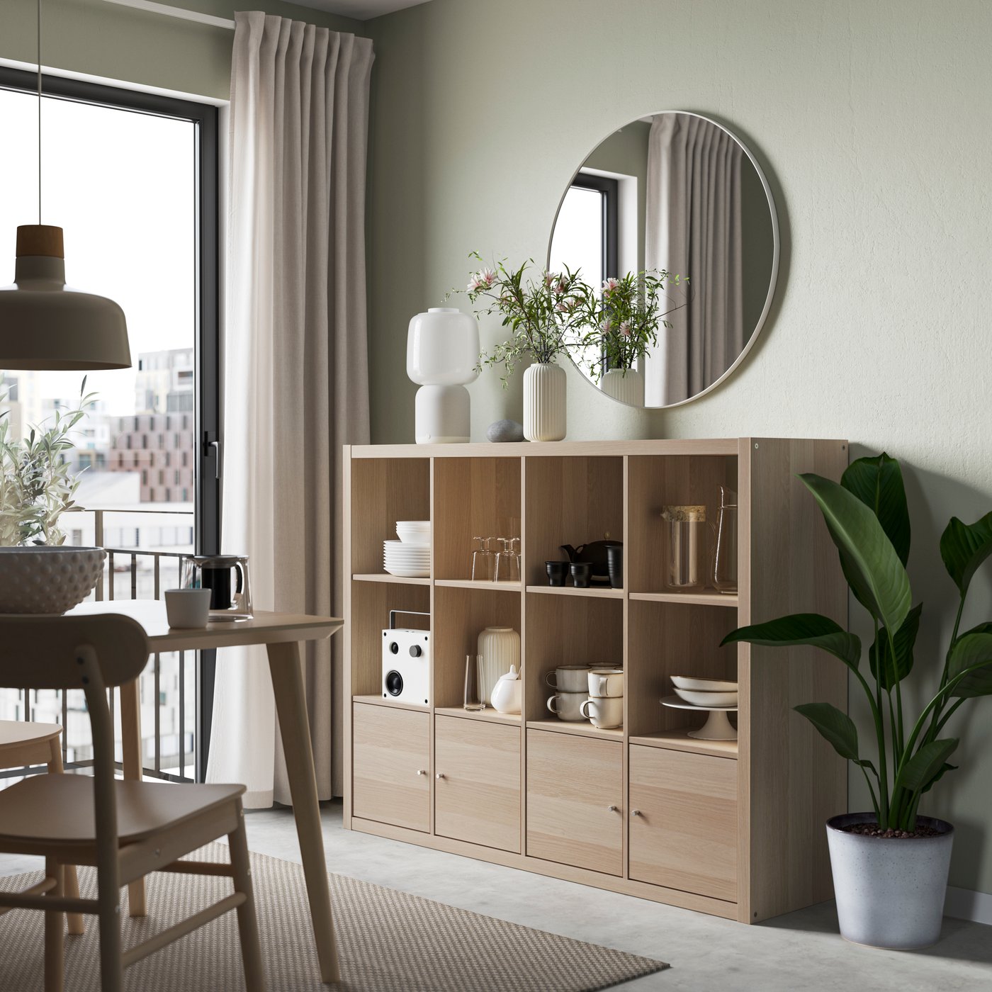 A white stained oak effect KALLAX shelving unit with 4 inserts