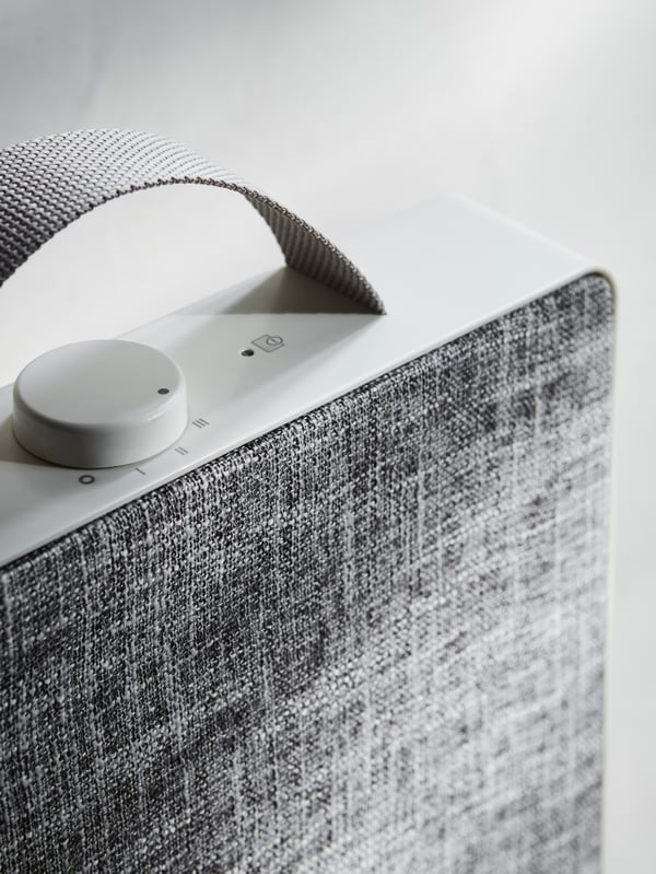 A white FÖRNUFTIG air purifier in the living room