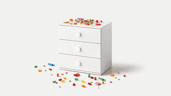 a GODISHUS chest of drawers with candy on top