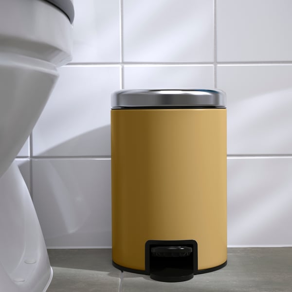 A dark yellow EKOLN waste bin