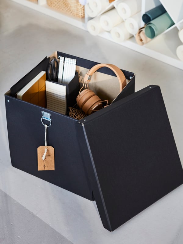 A black NIMM box filles with camera accessories.