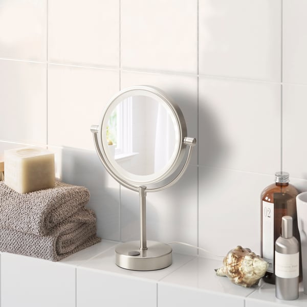 A battery-operated KAITUM mirror with integrated lighting