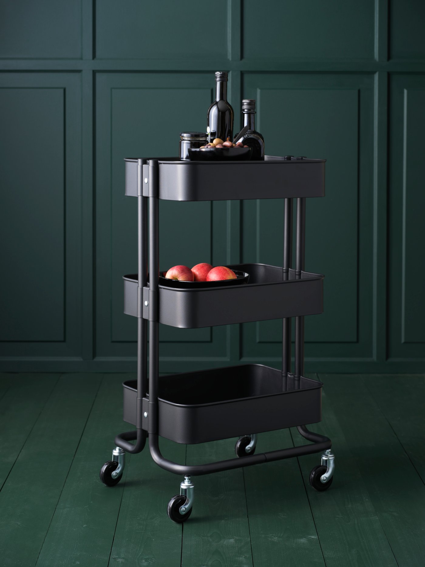 A black RÅSKOG trolley in the kitchen