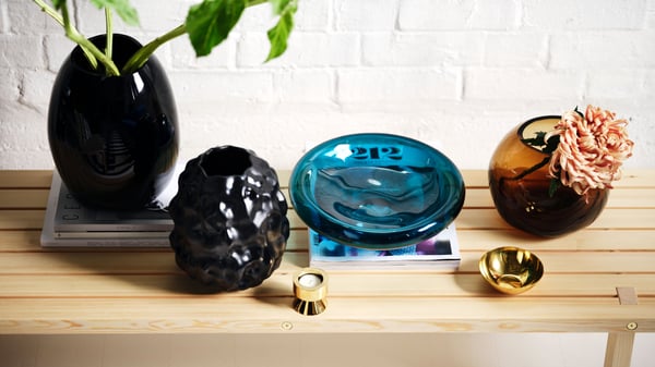 IKEA STOCKHOLM 2025 glass bowl and glass vases on a coffee table.