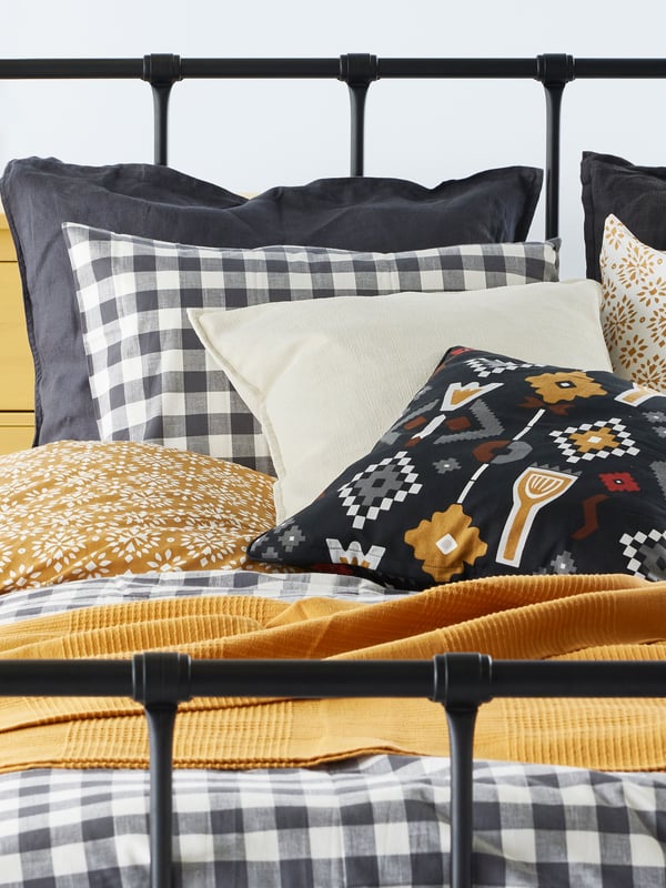A yellow-beige INDIRA bedspread