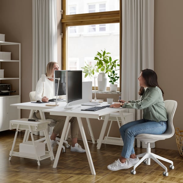 A white SKÅDIS shelf in the home office