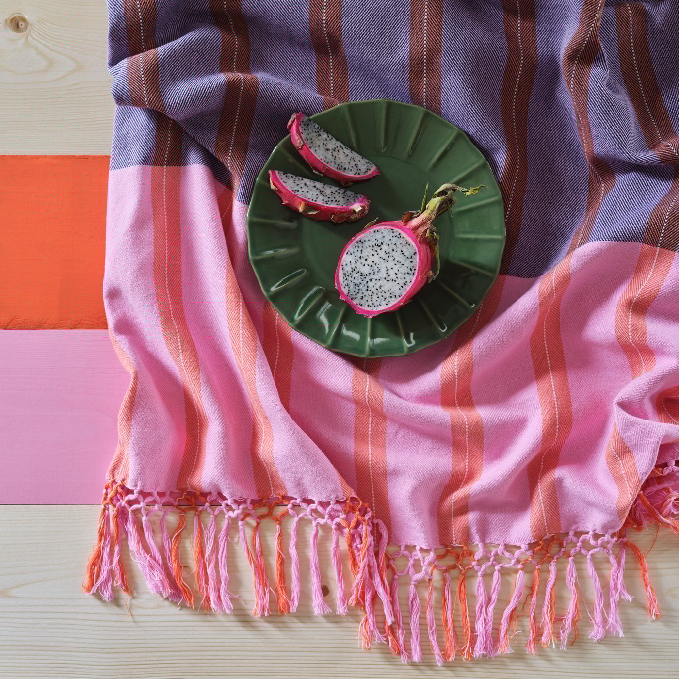 A pink/orange stripe MÄVINN throw
