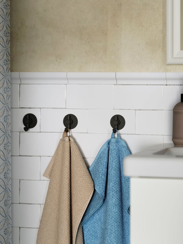 Une serviette d'invité GULVIAL beige dans la NA