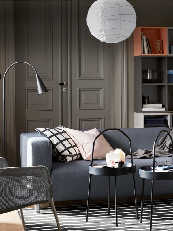 A Kabusa dark grey KLIPPAN 2-seat sofa in the living room