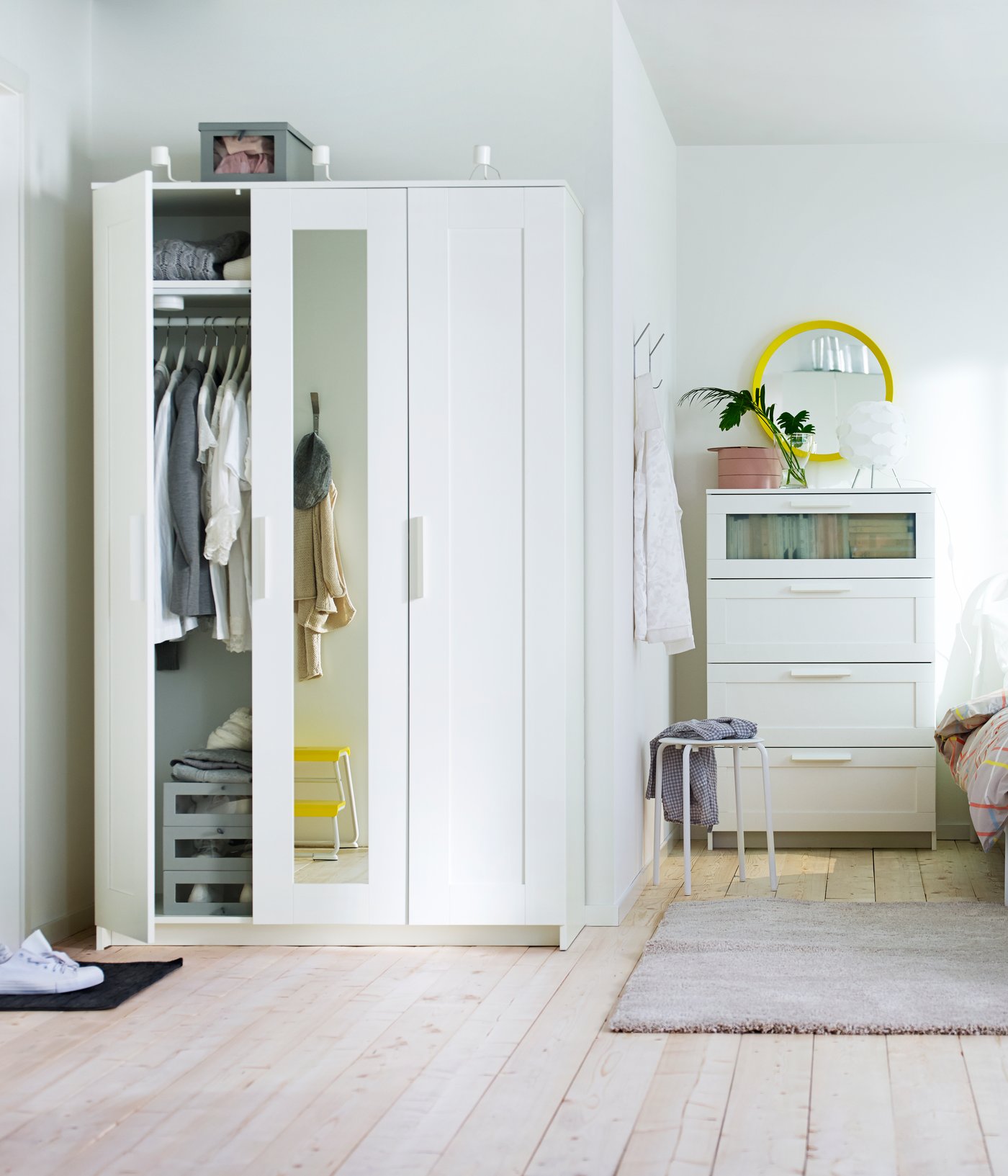 A white BRIMNES wardrobe with 3 doors in the bedroom