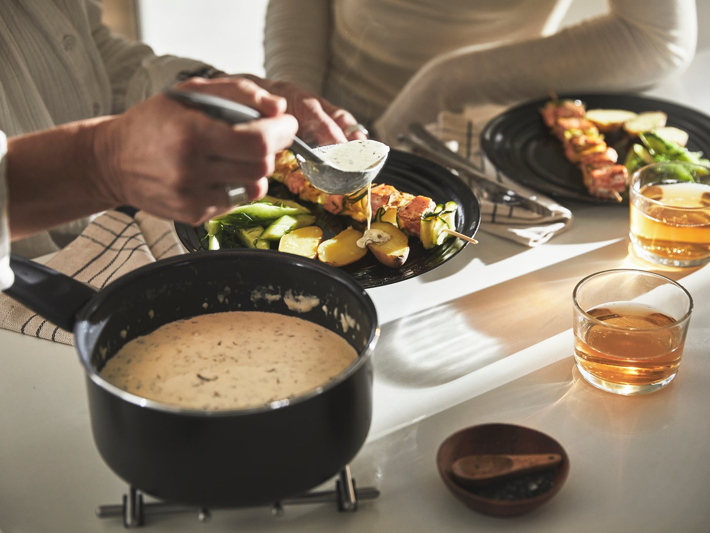 A non-stick coating black HEMLAGAD saucepan with lid