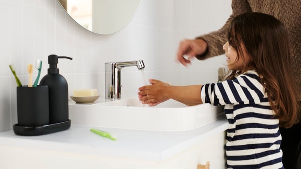 A white BACKSJÖN semi-recessed wash-basin in the bathroom