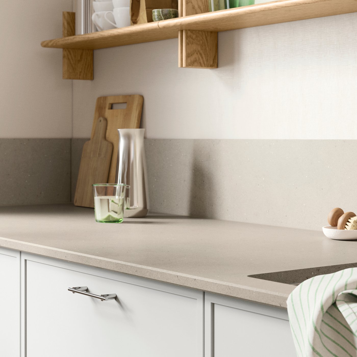 Part of a kitchen featuring an IKEA LOCKEBO dark beige limestone effect glass composite worktop.