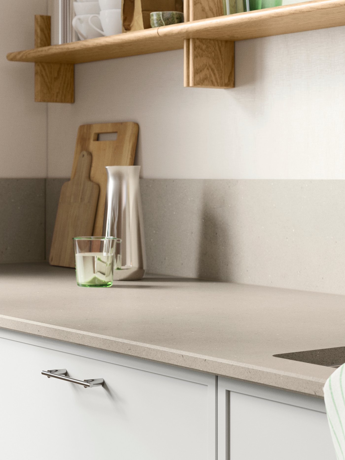 Part of a kitchen featuring an IKEA LOCKEBO dark beige limestone effect glass composite worktop.