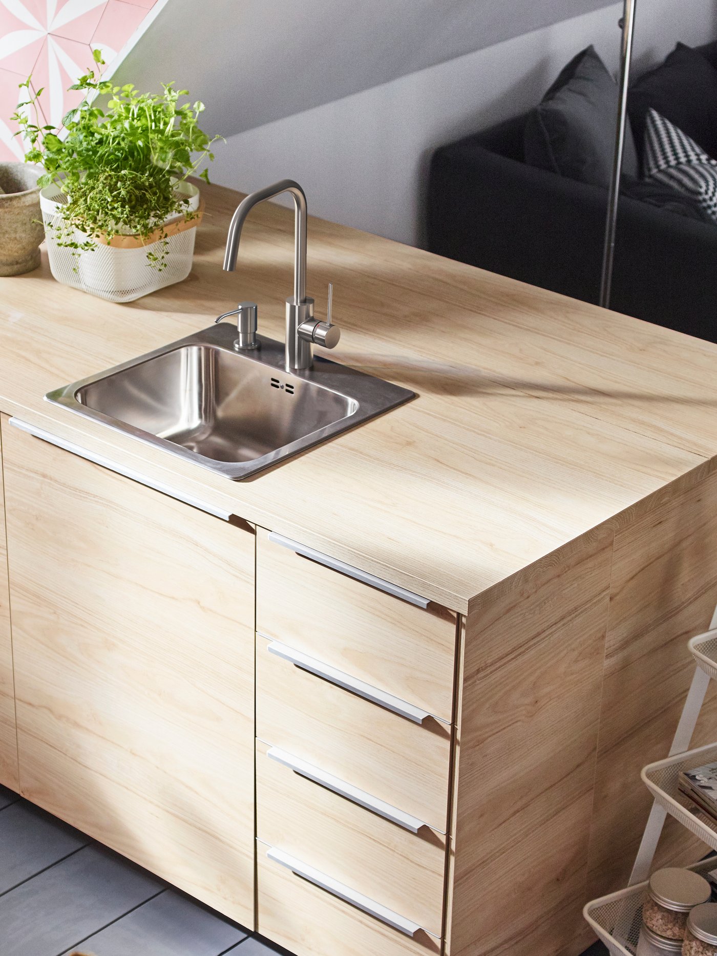 A light ash effect ASKERSUND drawer front in the kitchen