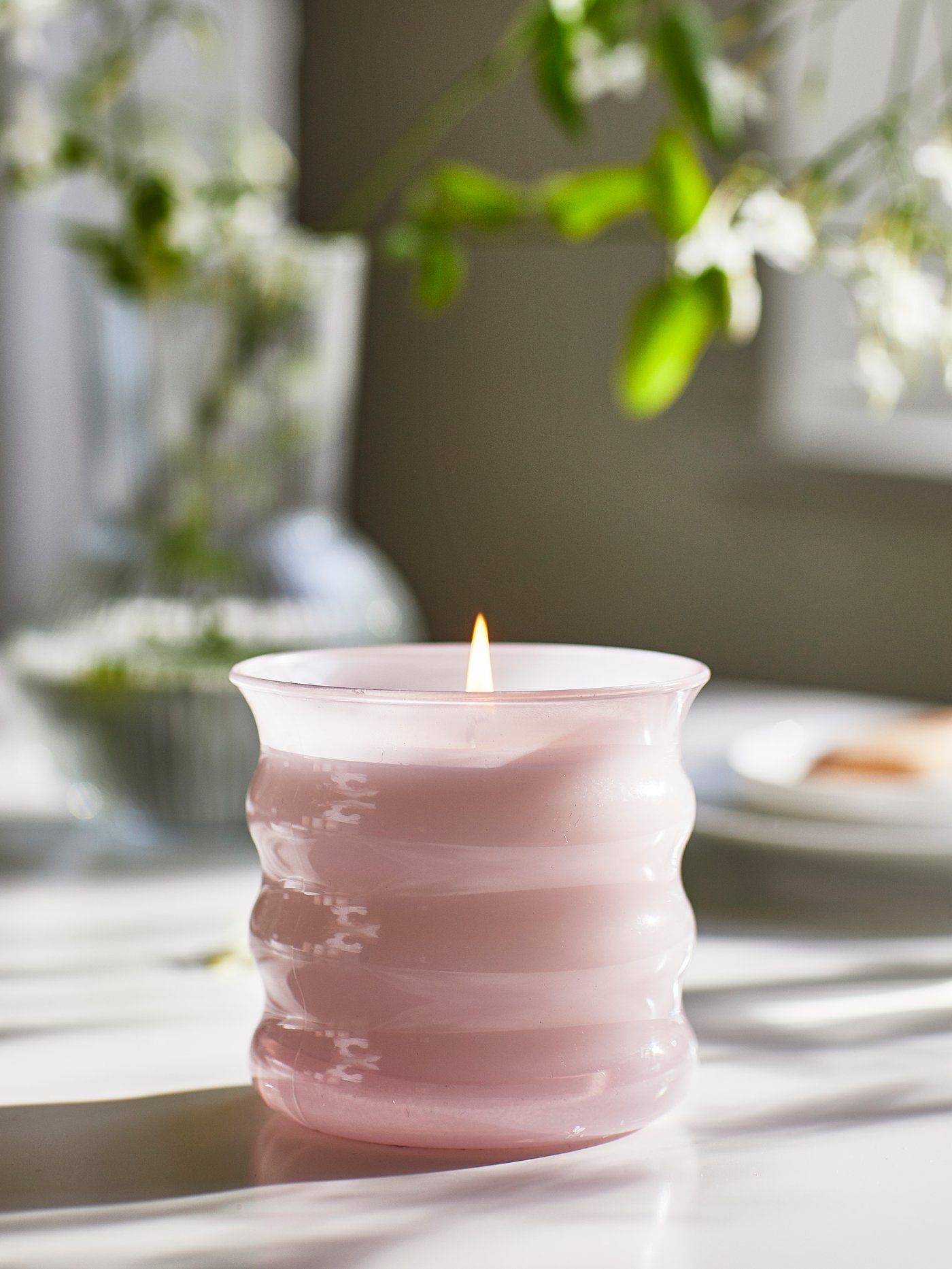 A Jasmine/pink LUGNARE scented candle in glass