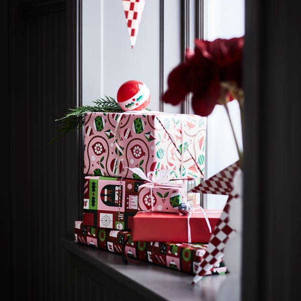 Close-up of rustic holiday gift wrapping with string and scissors.