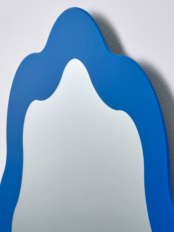 A blue PRUNKHALLON mirror