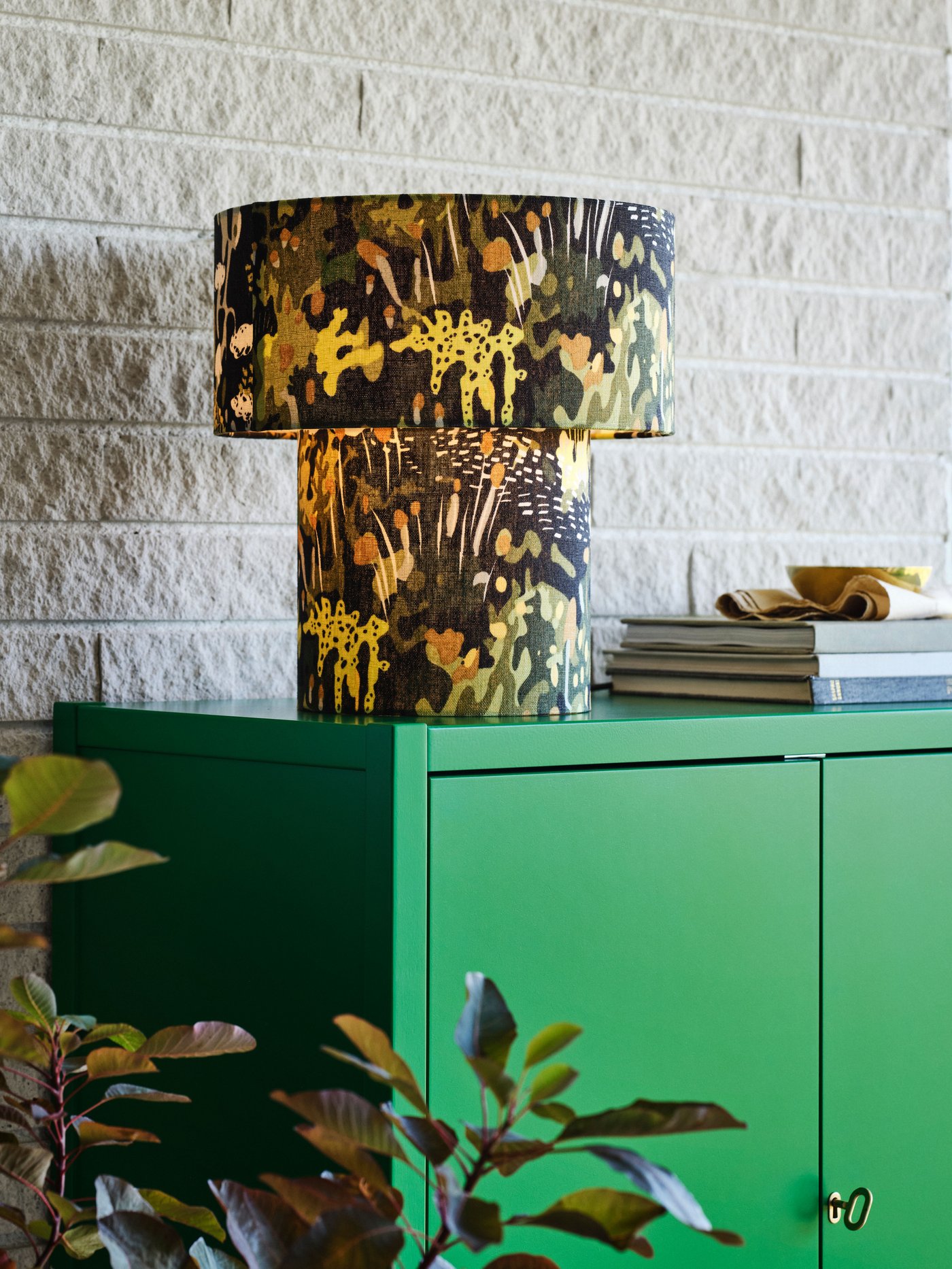 A green STOCKHOLM 2025 cabinet with 2 doors