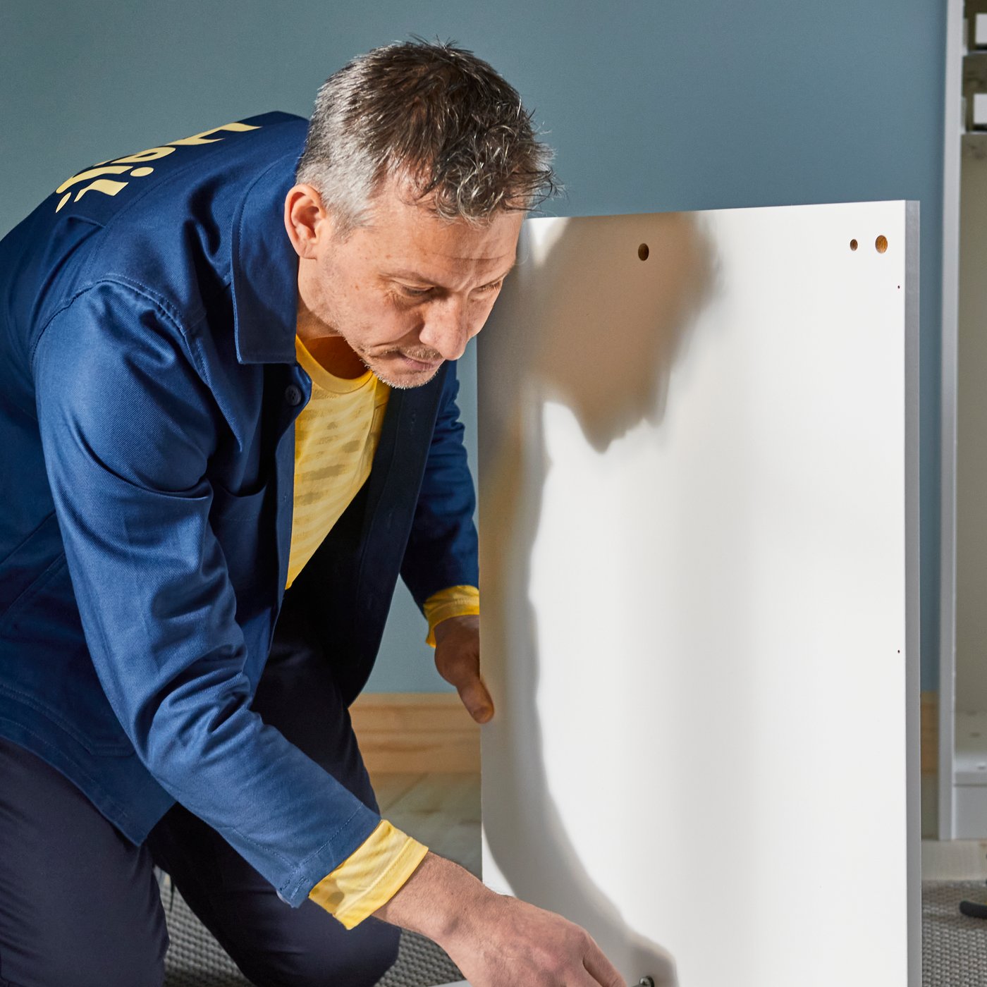 Man assembling IKEA product