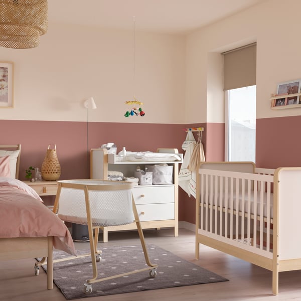 A birch/white ÄLSKVÄRD cot in a master bedroom