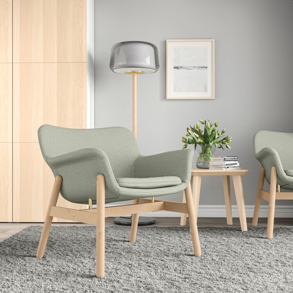 A Gunnared light green VEDBO armchair in the living room