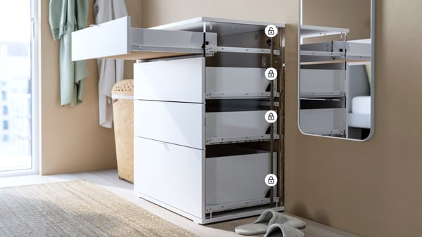 White VIHALS 4-drawer chest showing Anchor and Unlock feature with top drawer open.