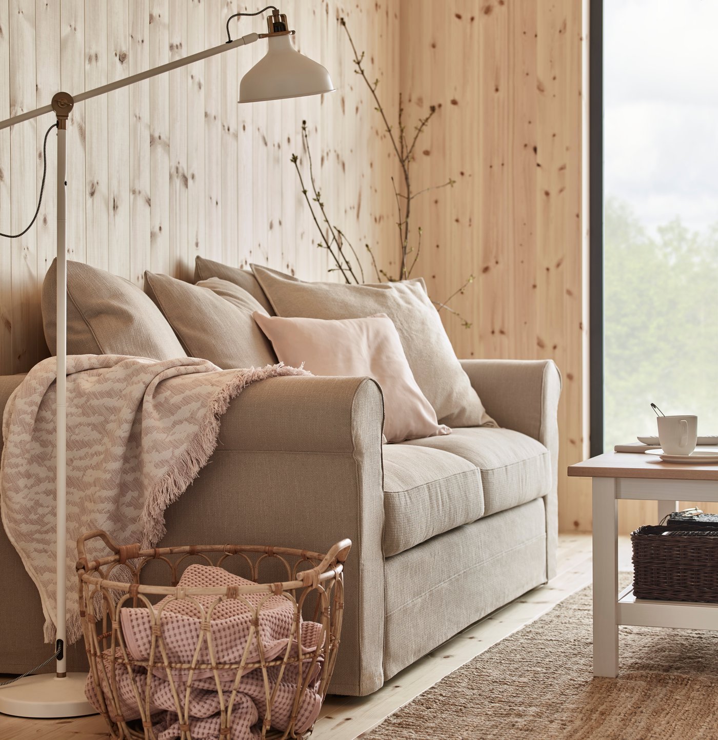 An off-white RANARP floor/reading lamp in the living room