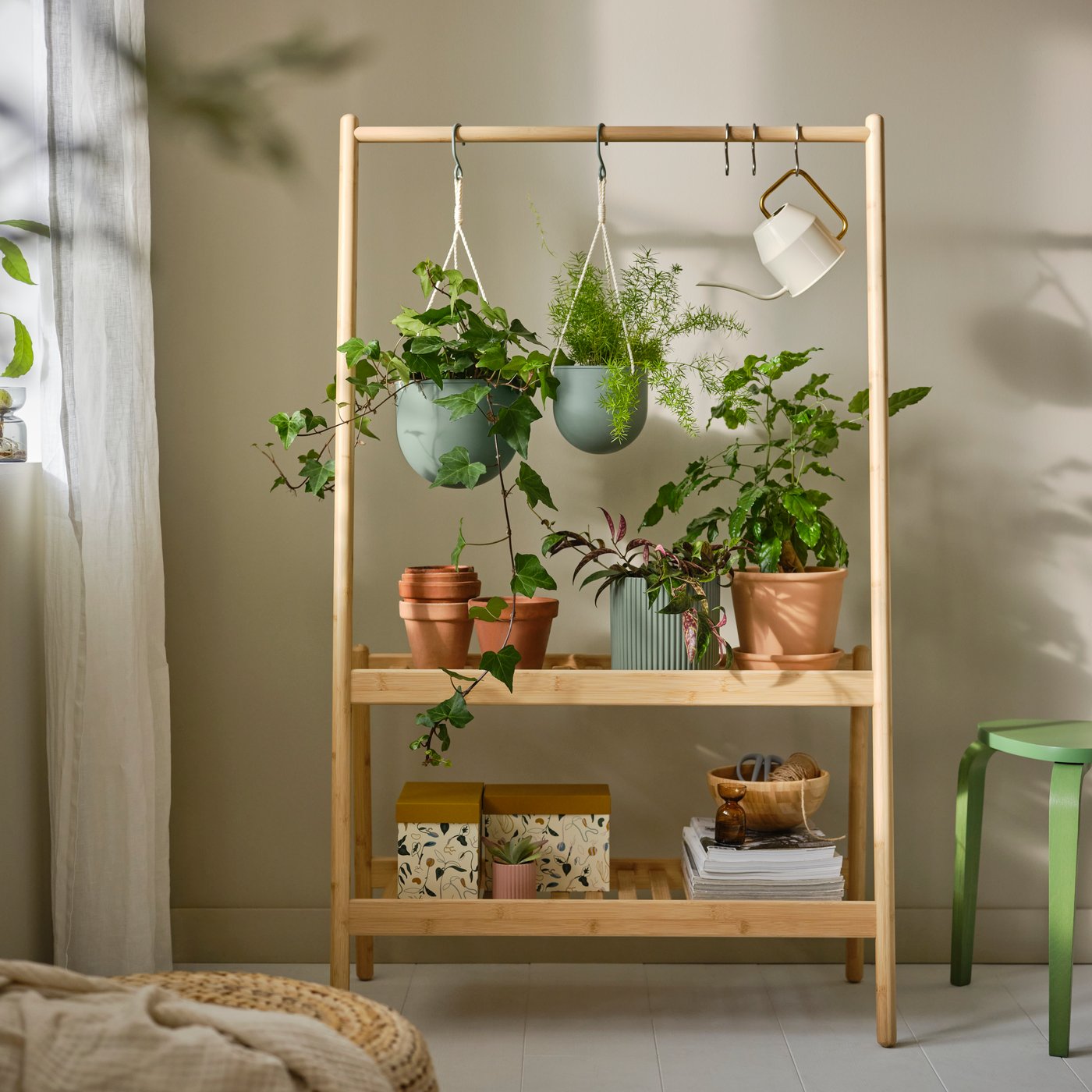 A bamboo DAKSJUS plant stand