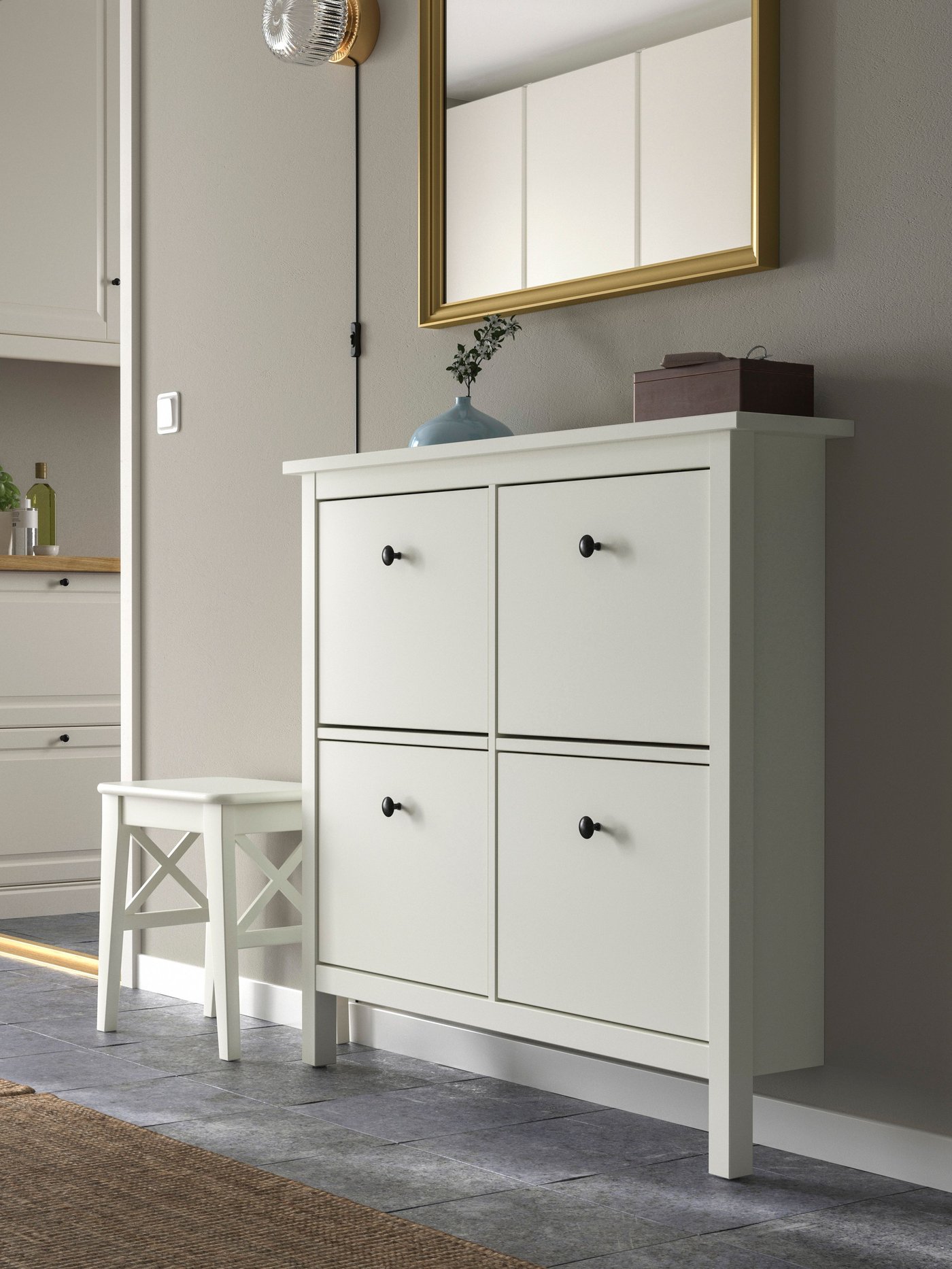 A white HEMNES shoe cabinet with 4 compartments