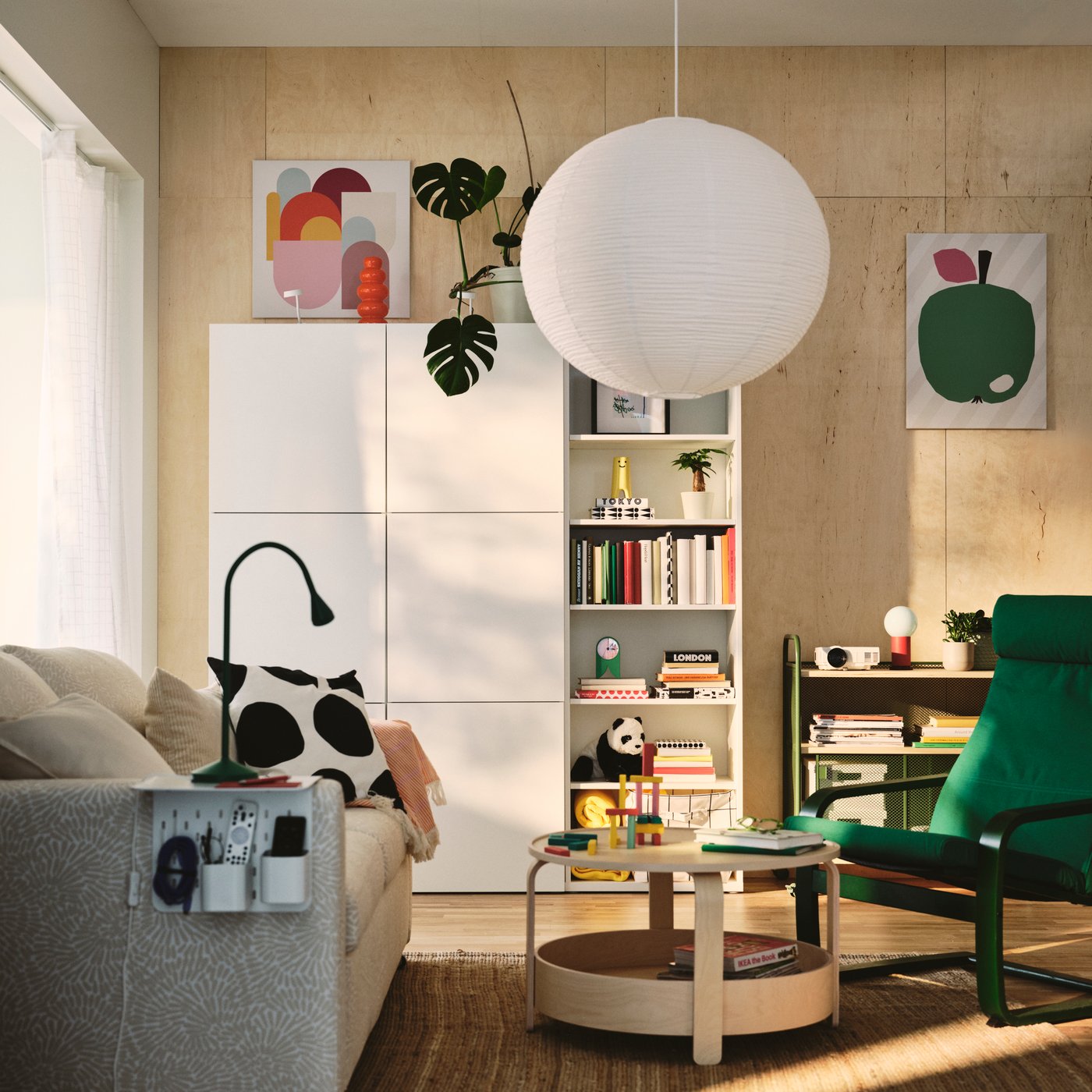 A living room features a light beige/white SALTSJÖBADEN 2-seat sofa-bed made from Vittangi and a white BESTÅ storage combination.