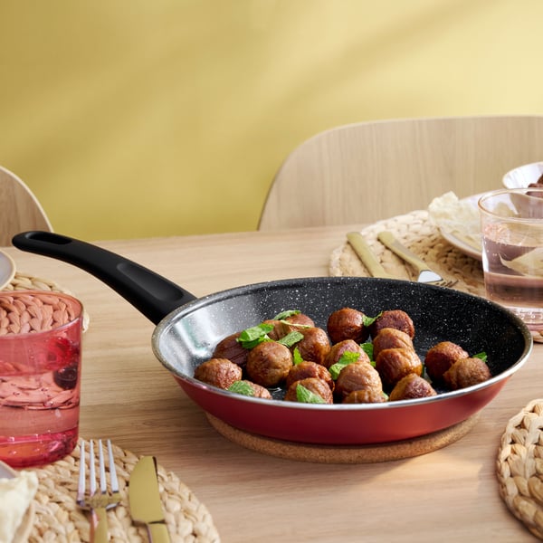 A non-stick coating red HEMLAGAD frying pan