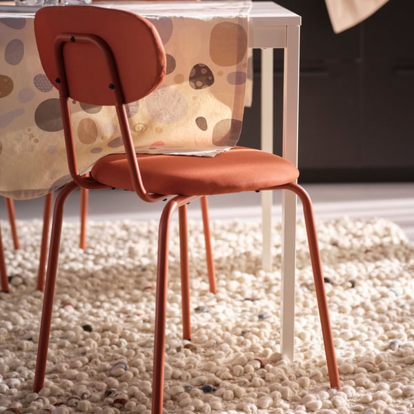 A red-brown Remmarn/red-brown ÖSTANÖ chair
