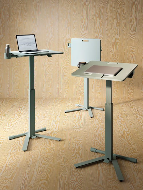Workspace featuring multiple green MITTZON laptop tables with castors, adjustable heights and mug/cup holders.