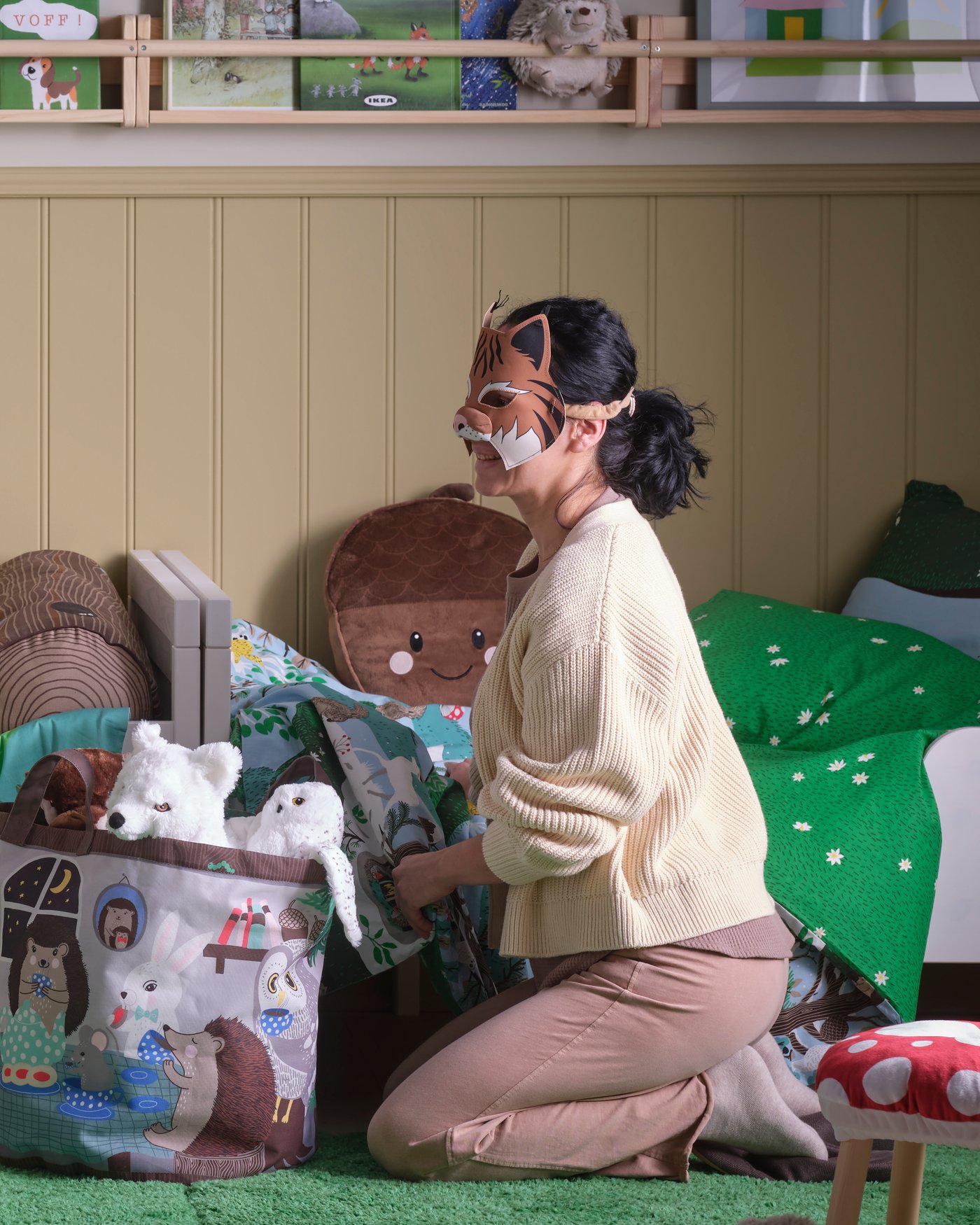 A forest animal pattern/multicolour SKOGSDUVA storage bag in the childrens room