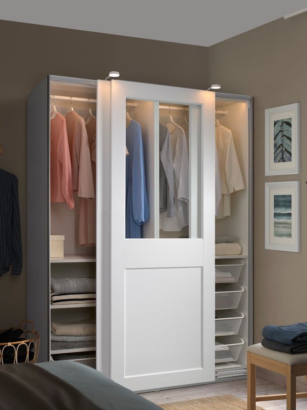 A white/clear glass white PAX wardrobe with sliding doors