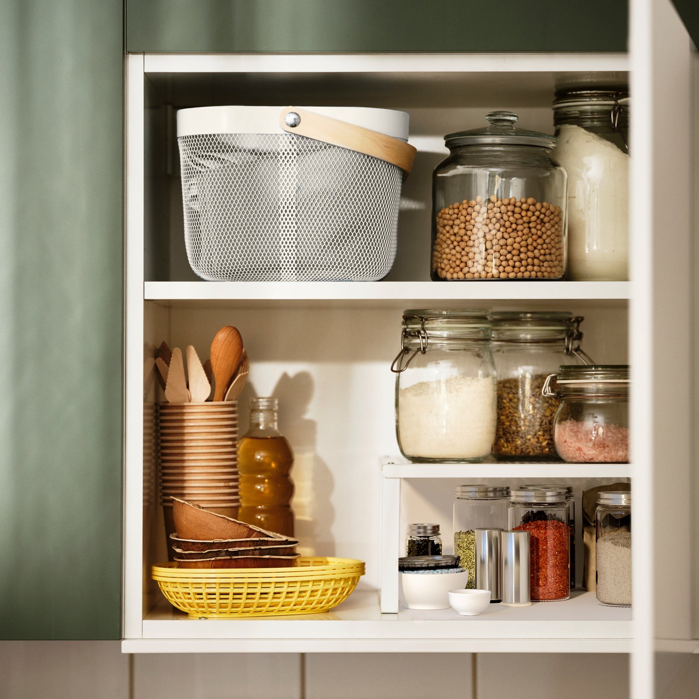 A clear glass VARDAGEN jar with lid