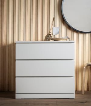 A white MALM chest of 3 drawers