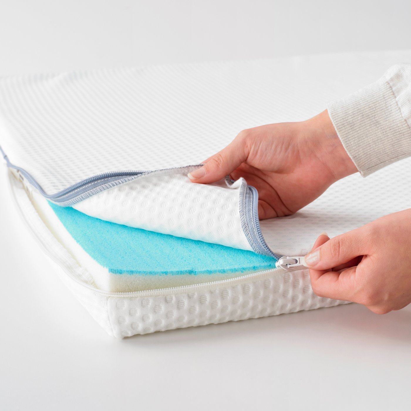 A white NÄSTABERG mattress pad