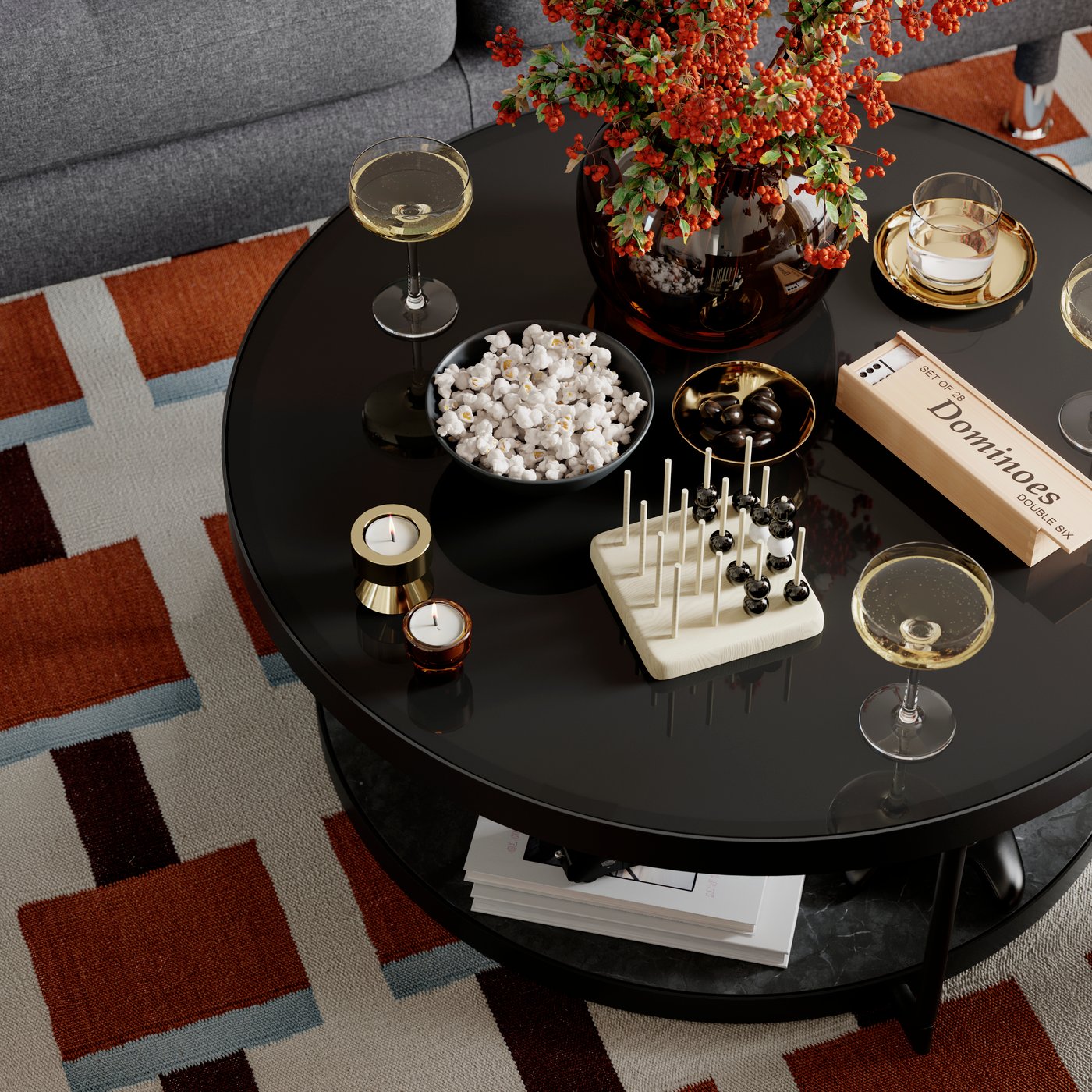 A FRÖTORP coffee table with snacks, glasses and other things on top of it stands on a STOCKHOLM 2025 rug.